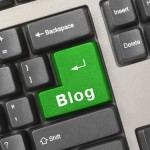 Keyboard with return key in green with the word blog