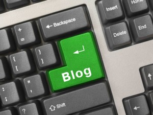 Keyboard with return key in green with the word blog