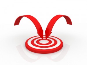 Red bullseye with two arrows focused on the center. Photo from Free Digital Photos.net